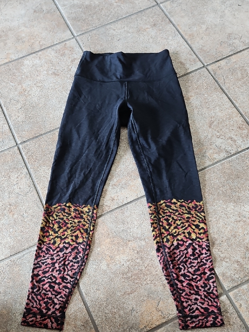 lululemon Black Leggings with Pink and Gold Accent Hem